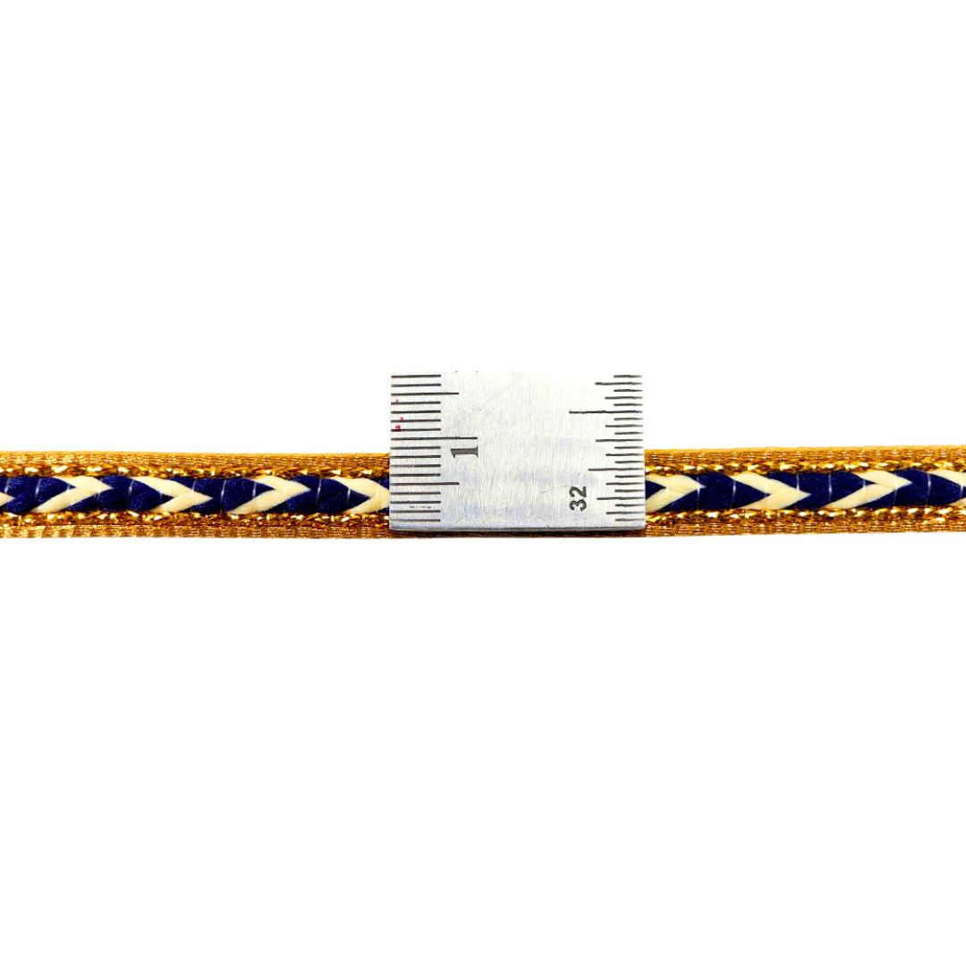 Navy and gold braided cord with a ruler for scale on a white background