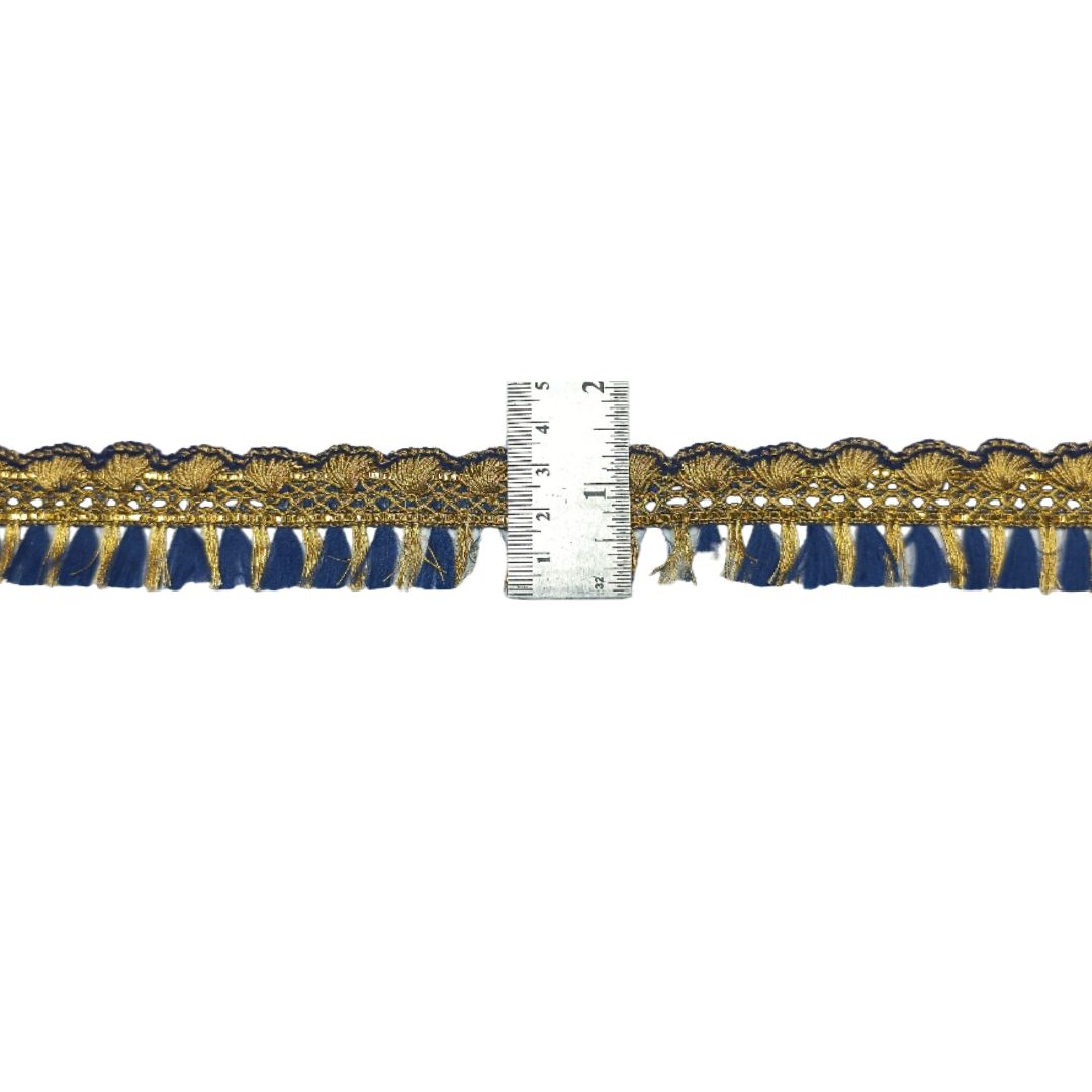 Navy blue and gold lace trim with a ruler for scale on a white background