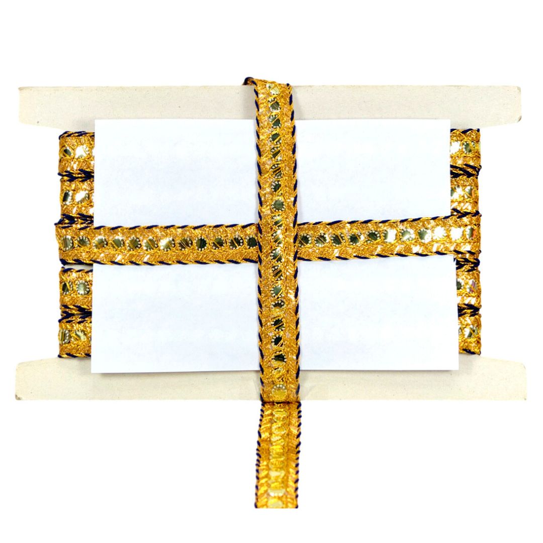 Gold and green decorative item on a white background