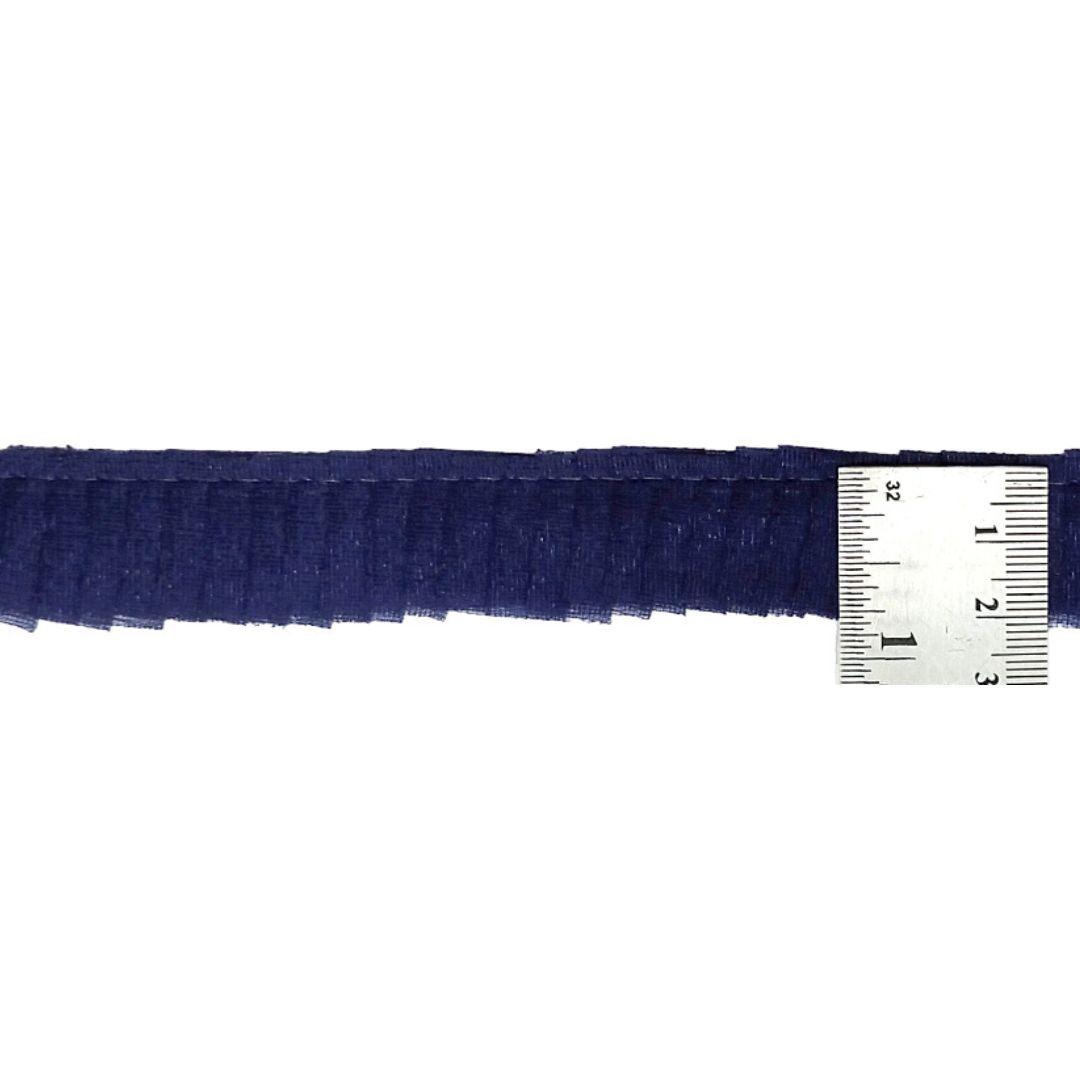 Navy blue ribbon with a ruler for measurement on a white background
