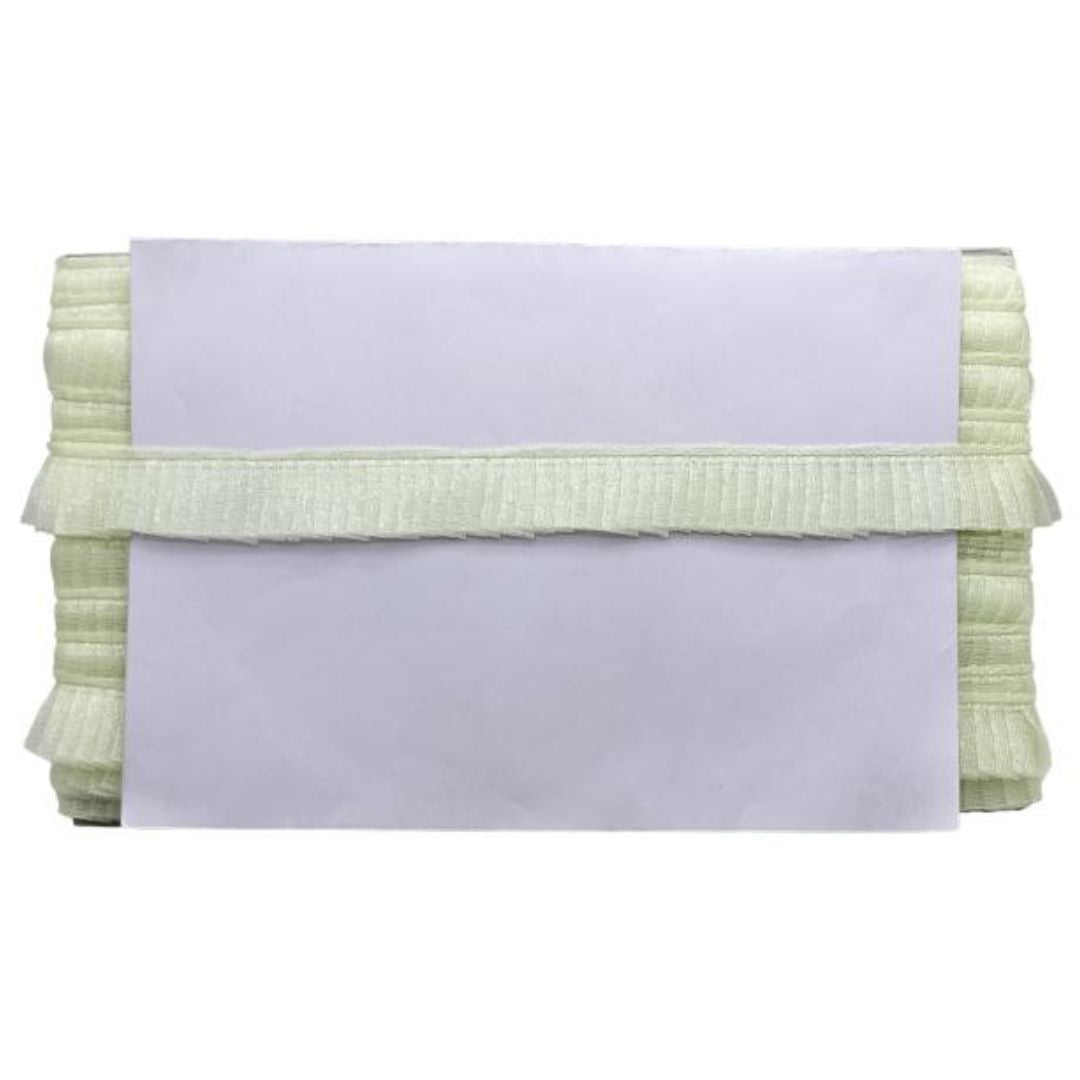 Light green textured clutch bag on a white background