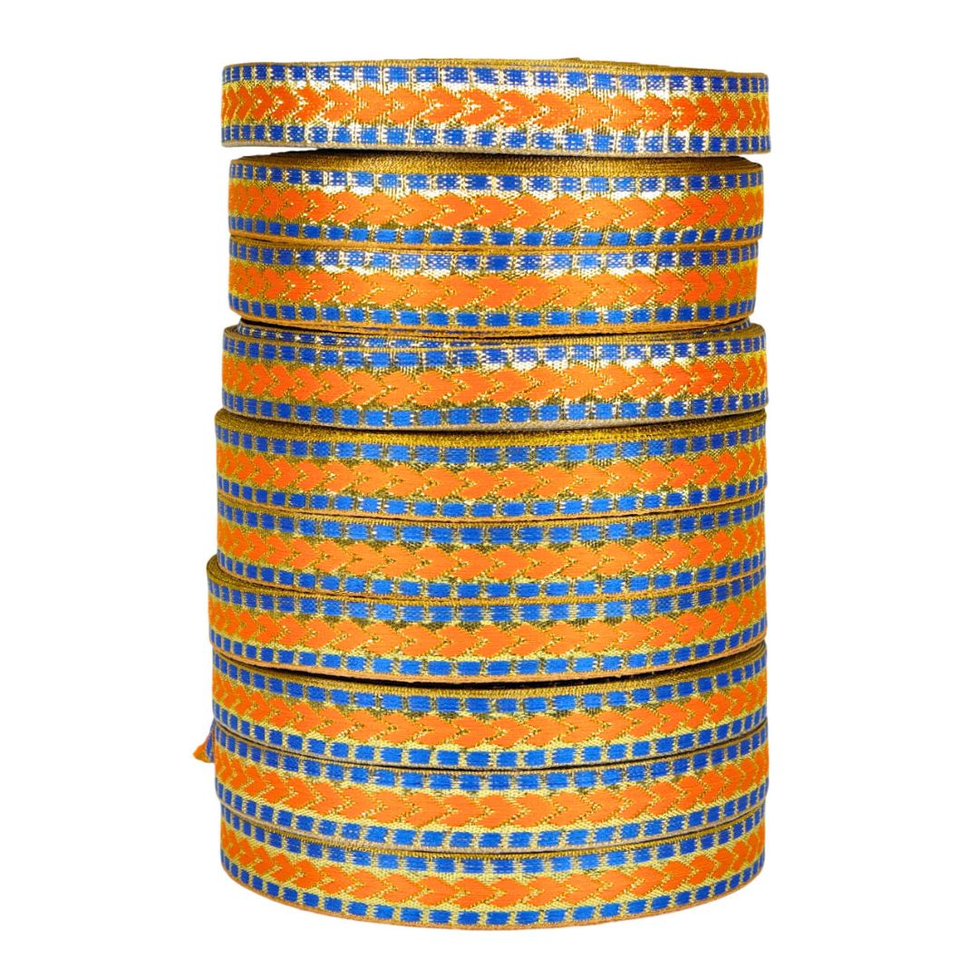 Stack of orange and blue patterned bangles on a white background
