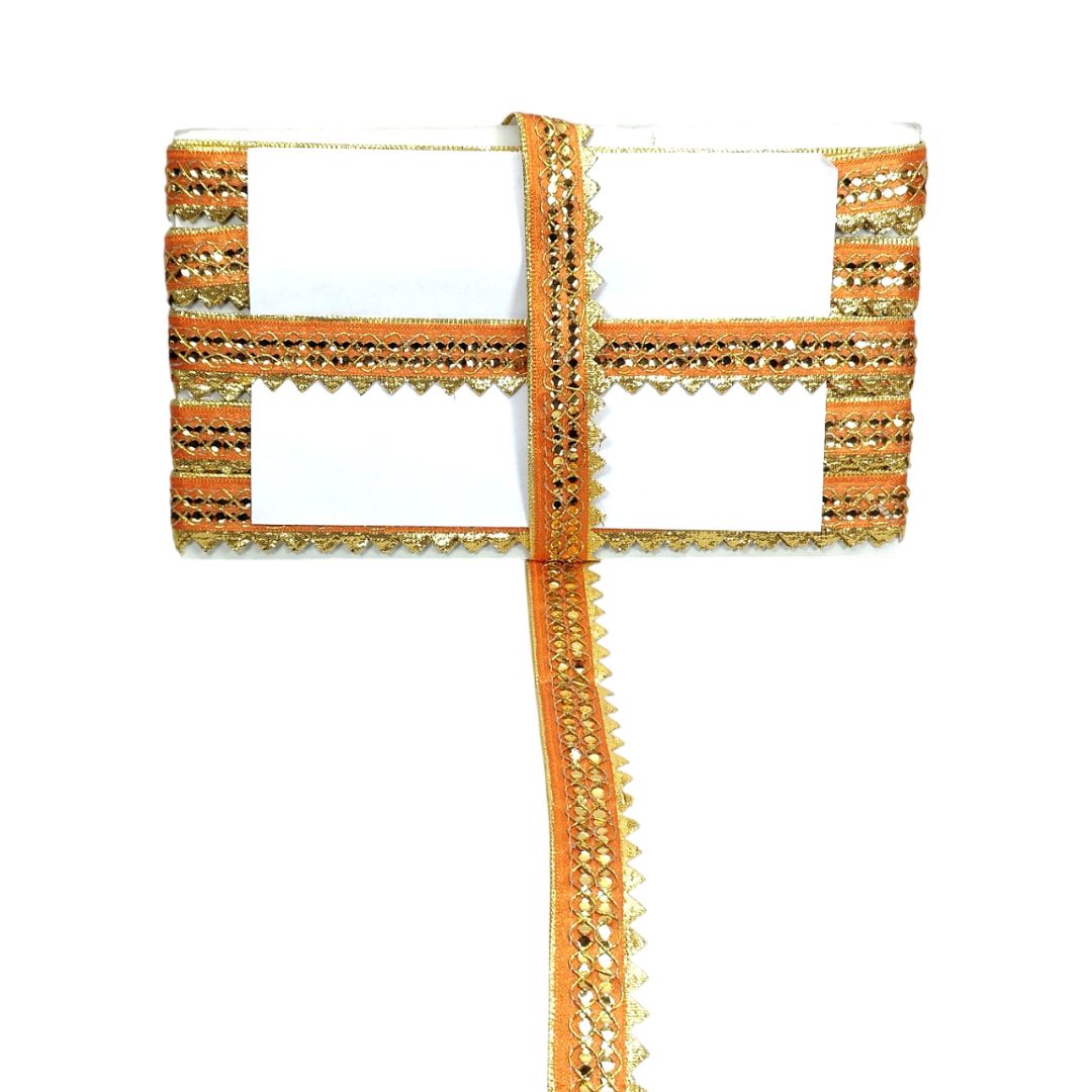 Decorative orange ribbon with gold trim on a white background