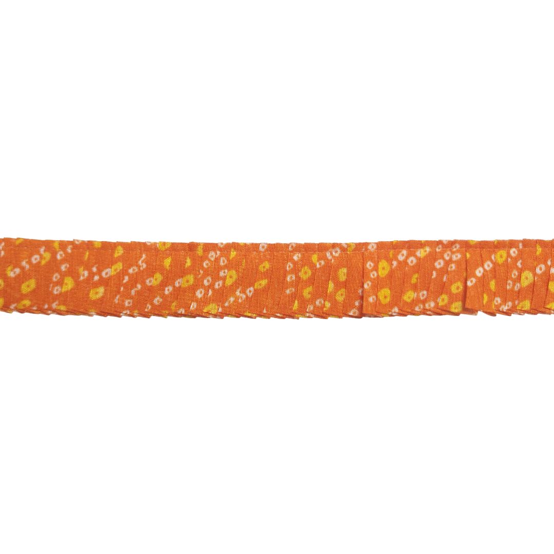 Orange ribbon with small yellow floral pattern on a white background