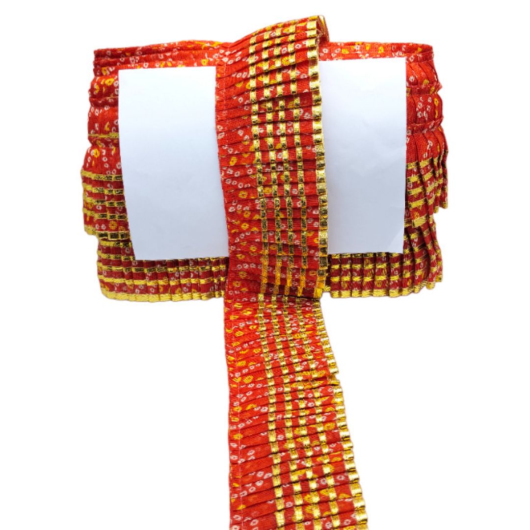 Red and yellow patterned fabric on a white background