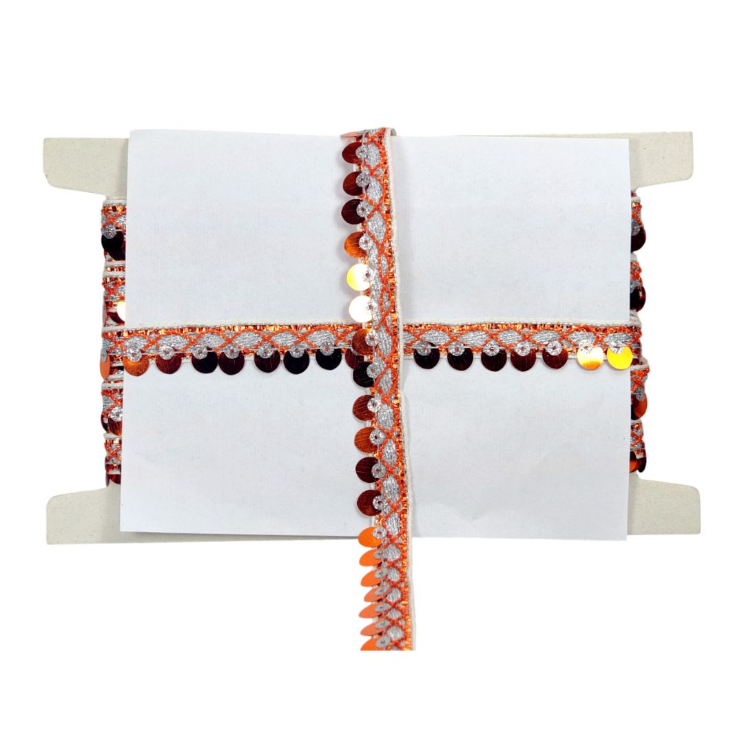 Decorative clutch with a white interior, orange and black exterior, and decorative elements on a white background.