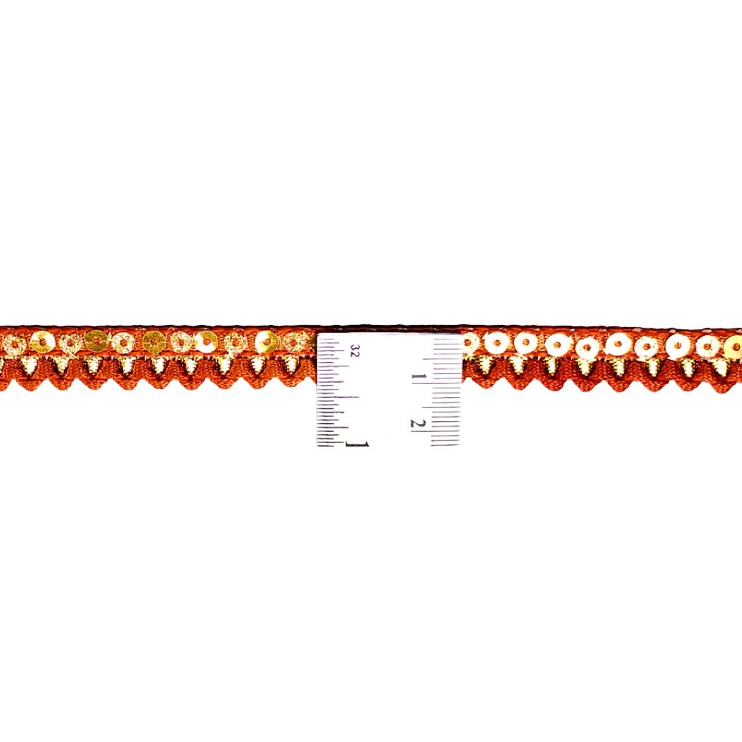 Decorative trim with a ruler for scale on a white background