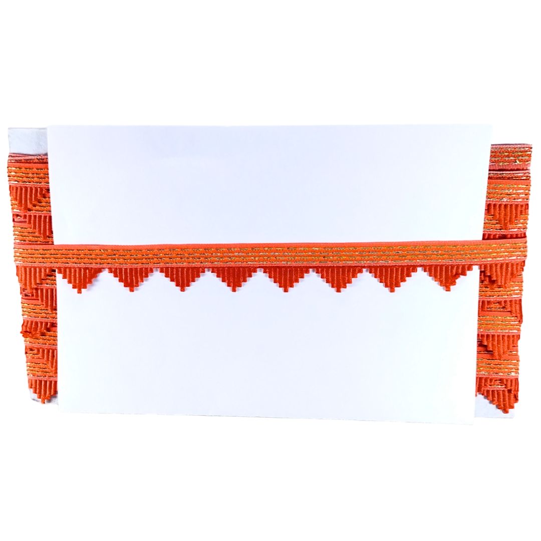 Orange woven chair with a white cushion on a white background