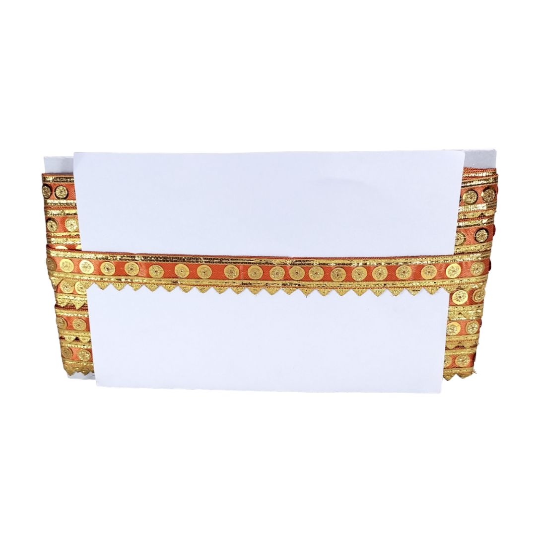Decorative valance with gold and red pattern on a white background