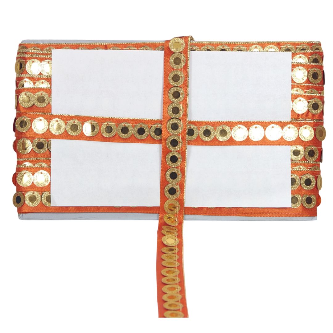 White saree with orange border featuring gold and black sequins on a white background