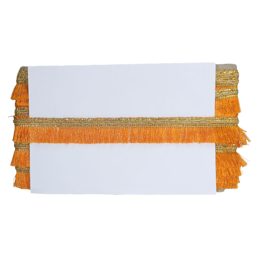 Table runner with orange and gold fringe on a white background
