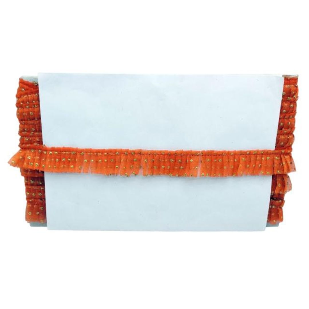 White clutch with orange decorative trim on a white background