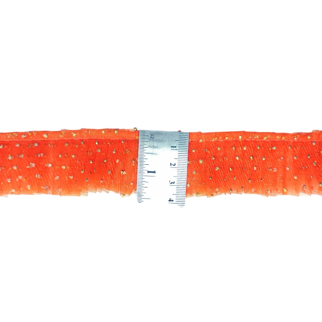 Orange mesh ribbon with a ruler for scale on a white background