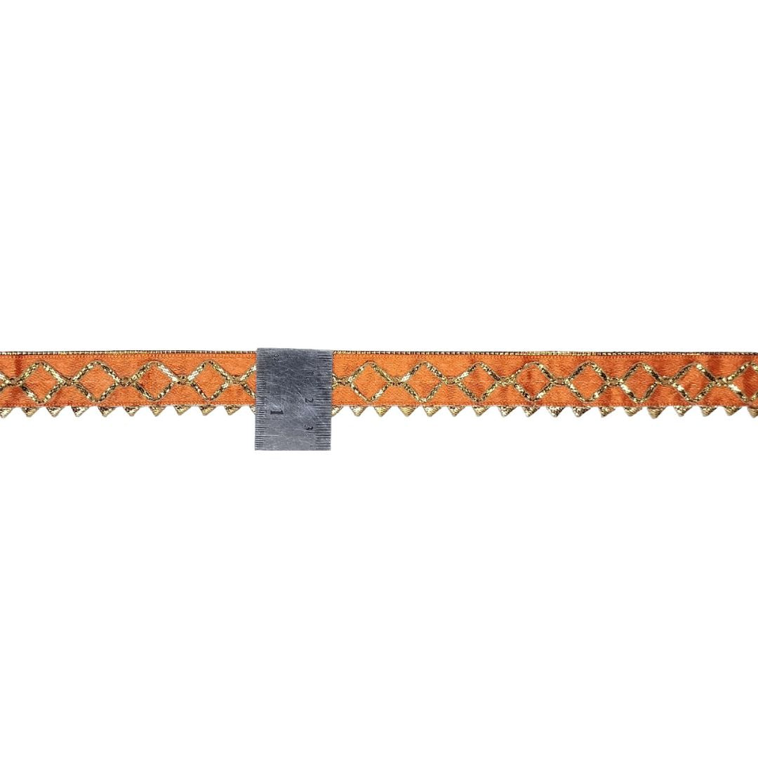Decorative border with orange and gold pattern on a white background