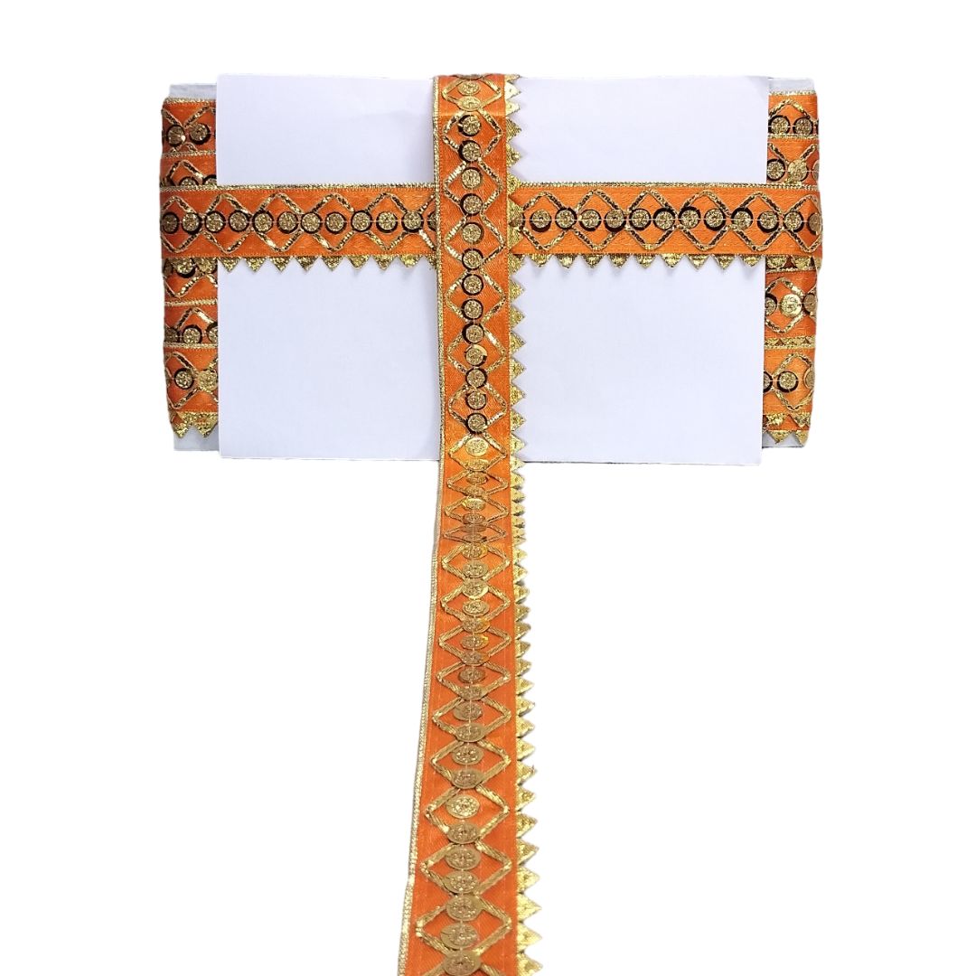 Decorative orange and gold ribbon with intricate patterns on a white background