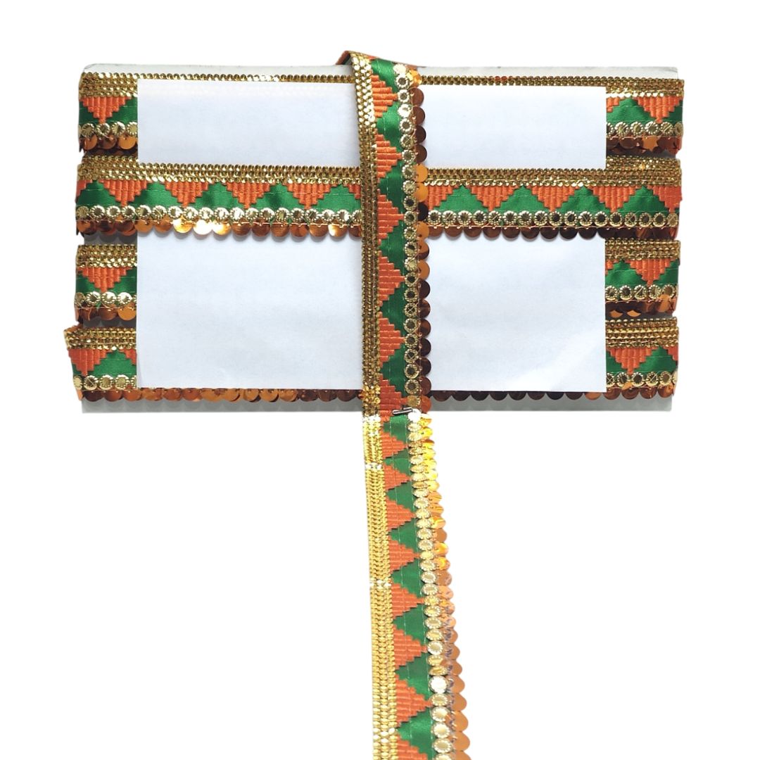 Decorative clutch with green, orange, and gold patterns on a white background