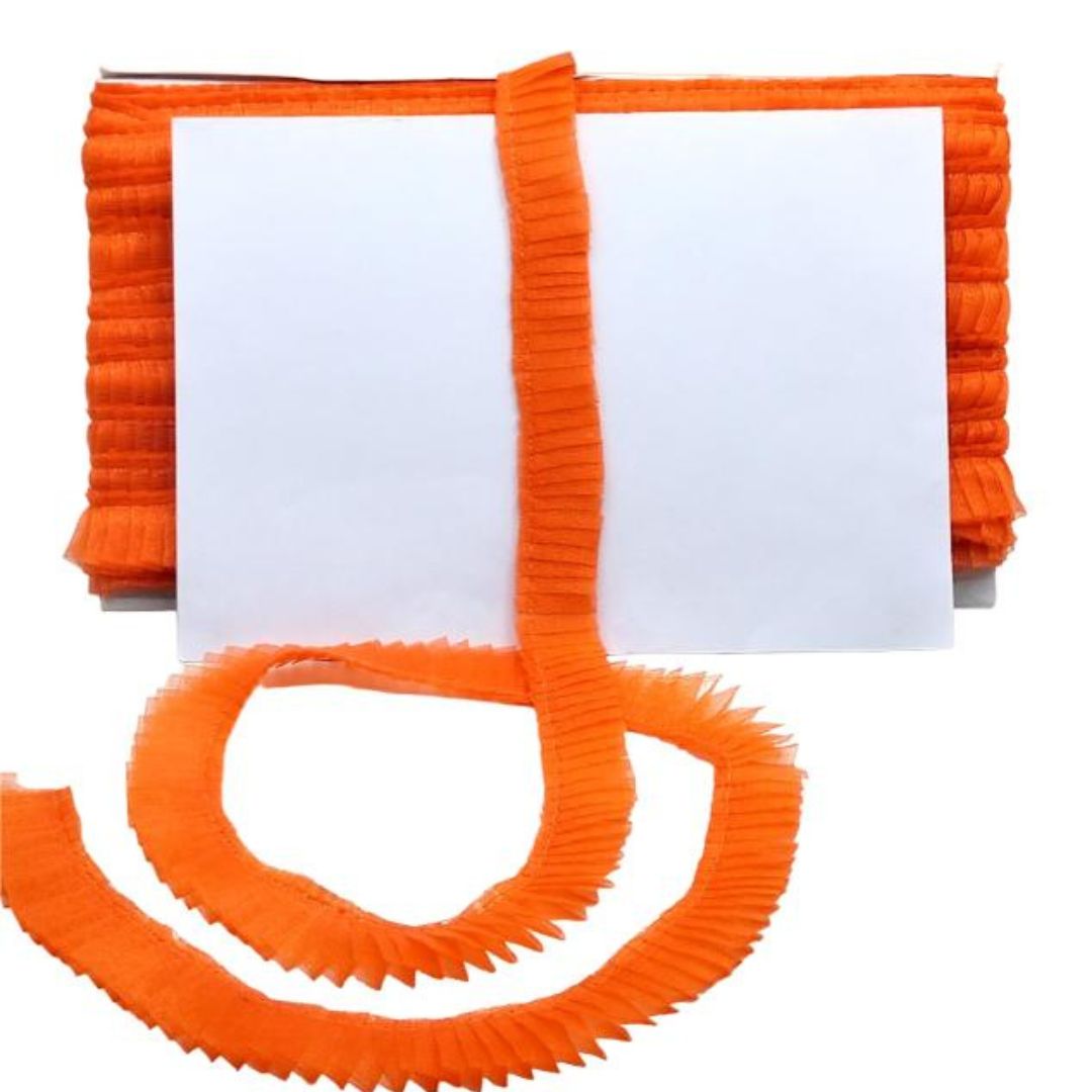 Orange ribbons with a white card on a white background