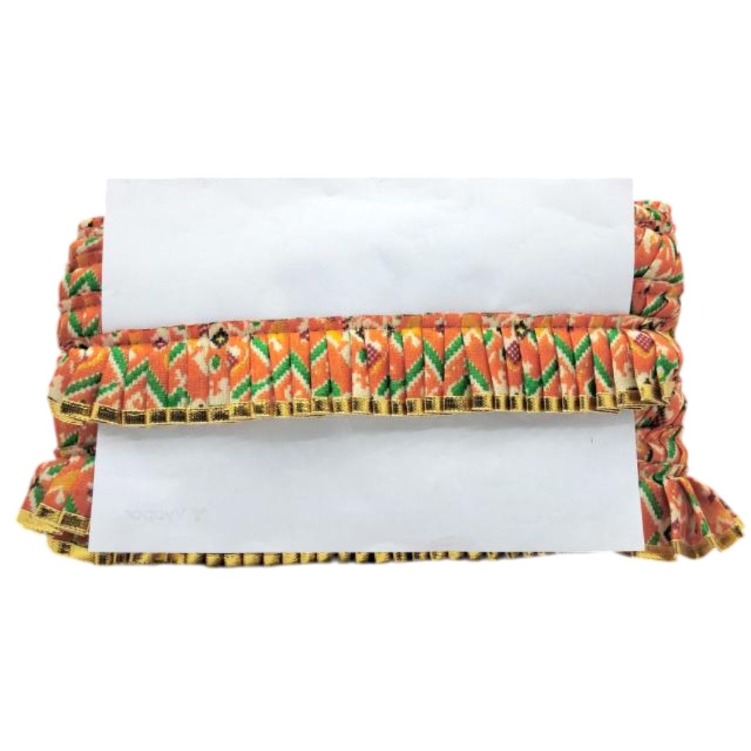 Folded fabric with colorful pattern on a white background