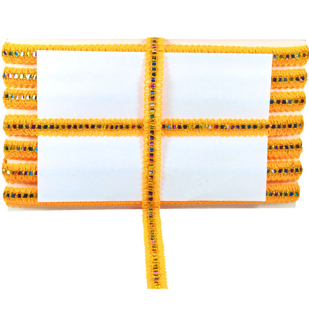 Yellow bracelet with decorative beads on a white background