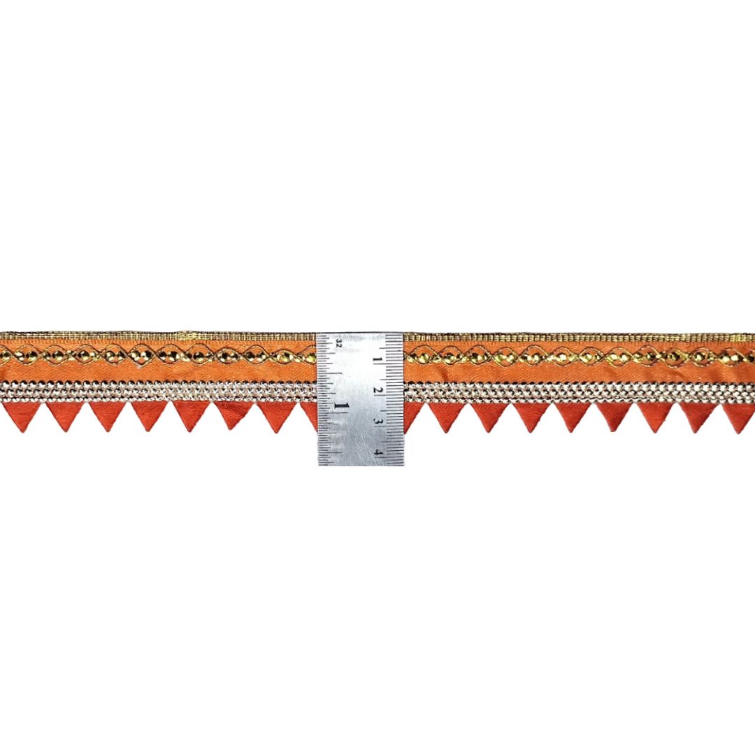 Decorative ribbon with a ruler for scale on a white background