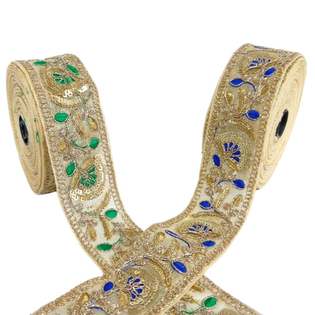 Decorative ribbon with gold, blue, and green patterns on a white background