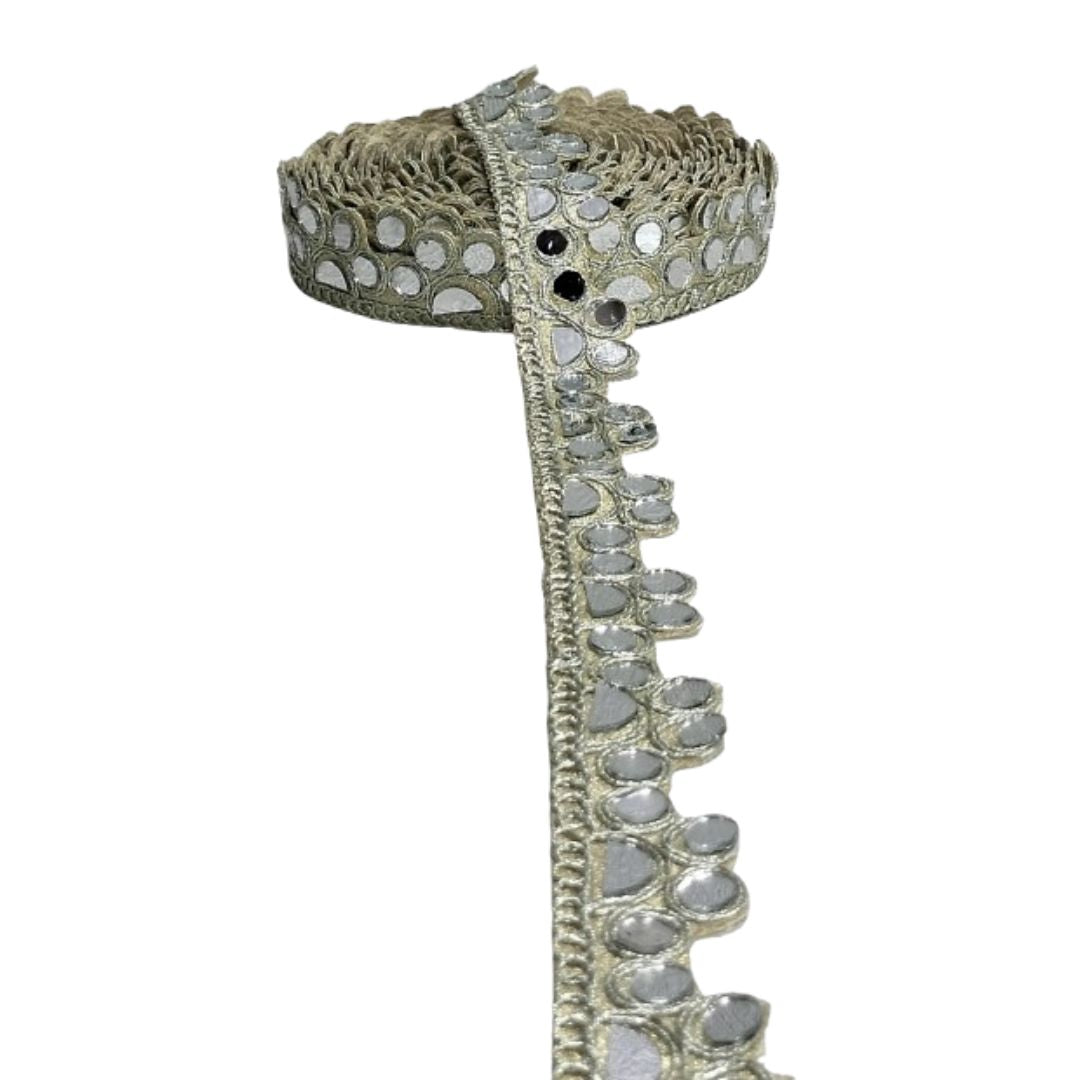 Decorative belt with intricate silver design on a white background