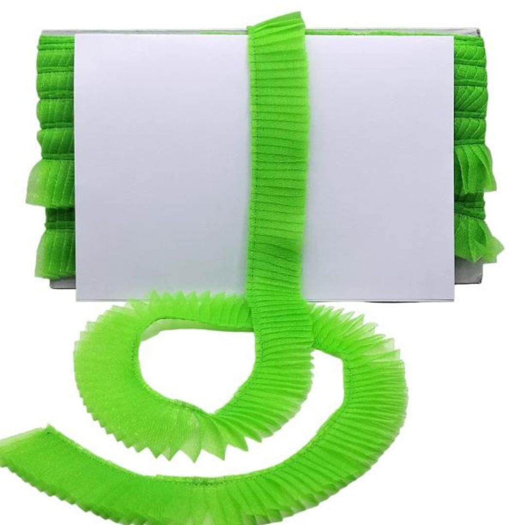 Green springy strip with a white book on a white background