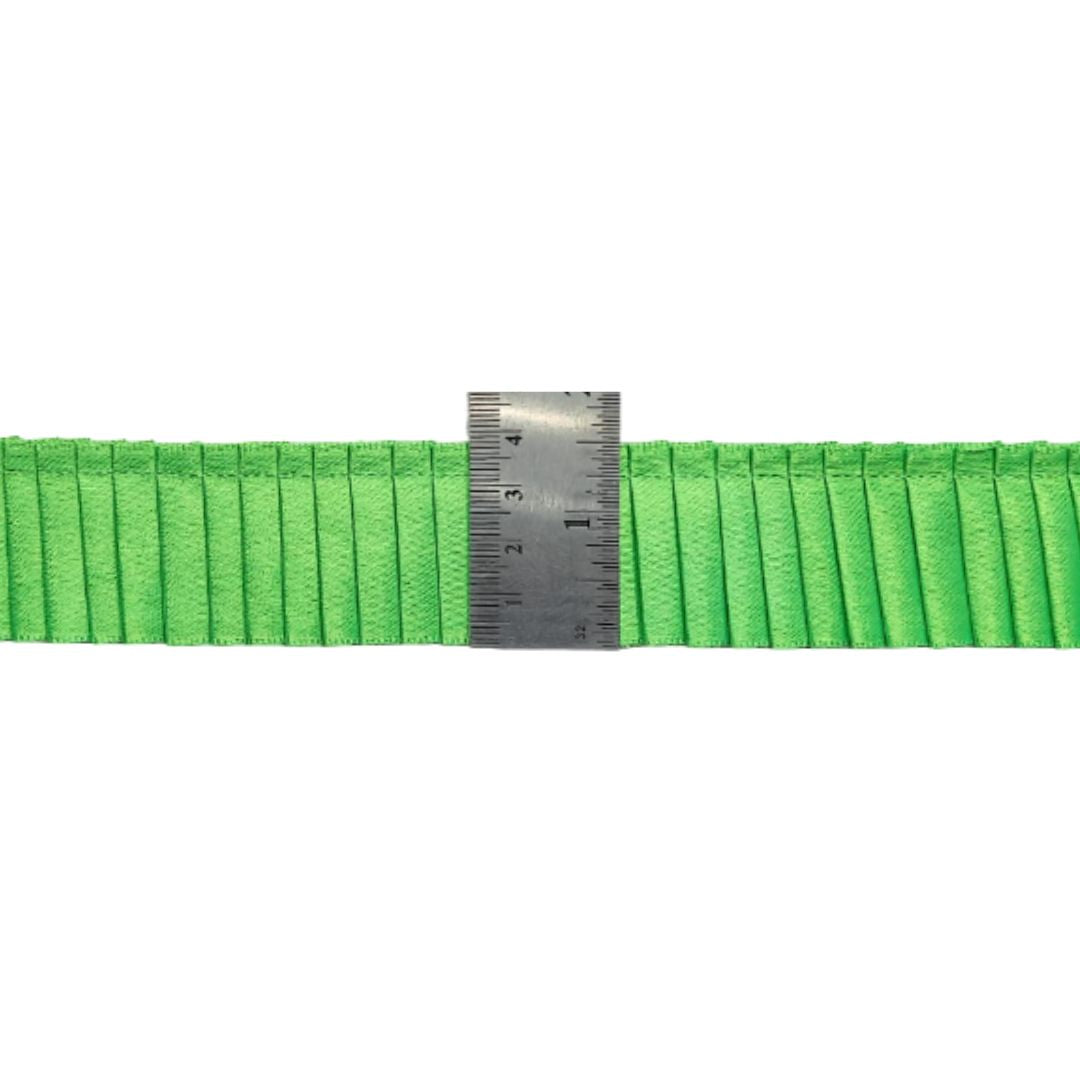 Green webbing strap with a ruler for measurement on a white background