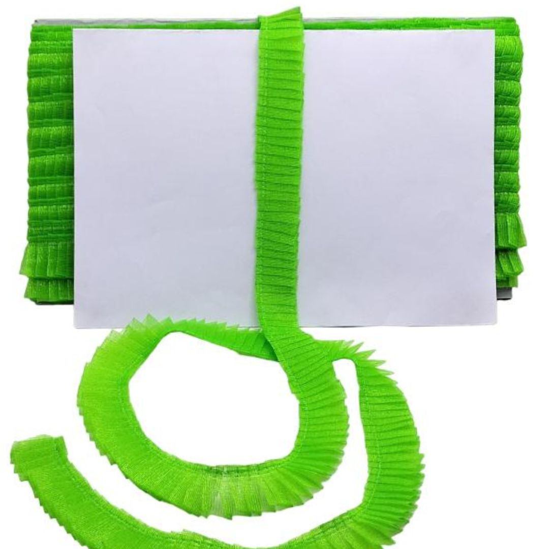 Green ribbons with a white card on a white background