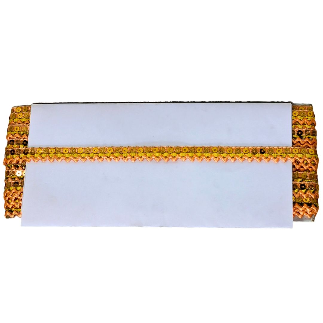 Decorative clutch with gold embellishments on a white background