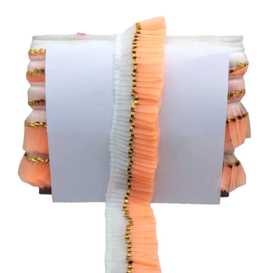 Stack of orange and white books with decorative gold trim on a white background