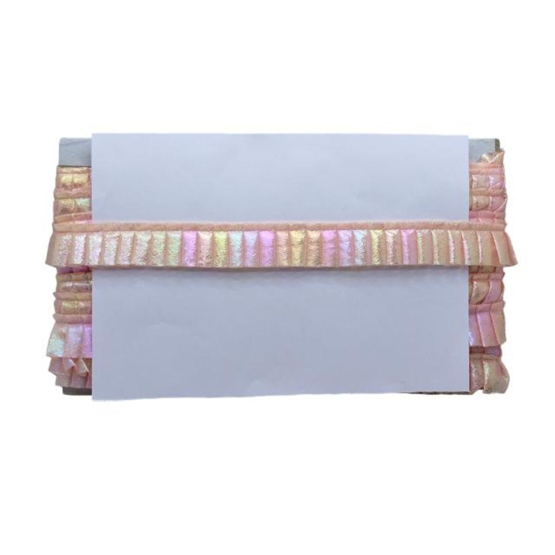 Decorative clutch with colorful ruffled edge on a white background