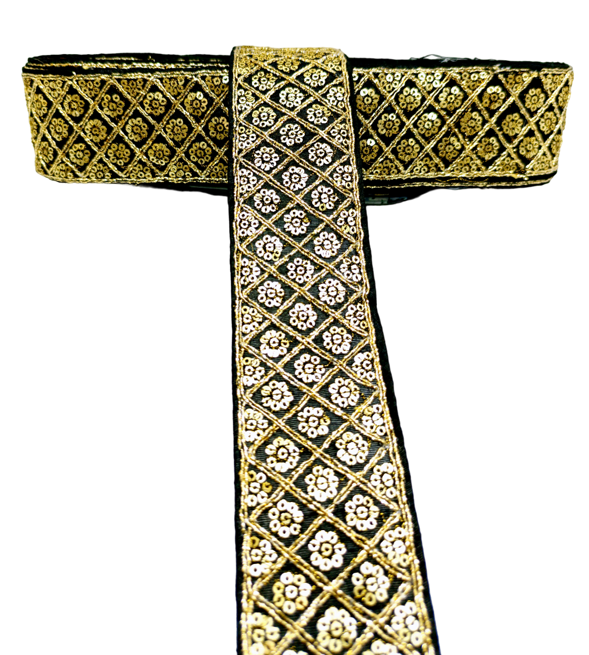 Decorative ribbon with gold and black pattern on a white background