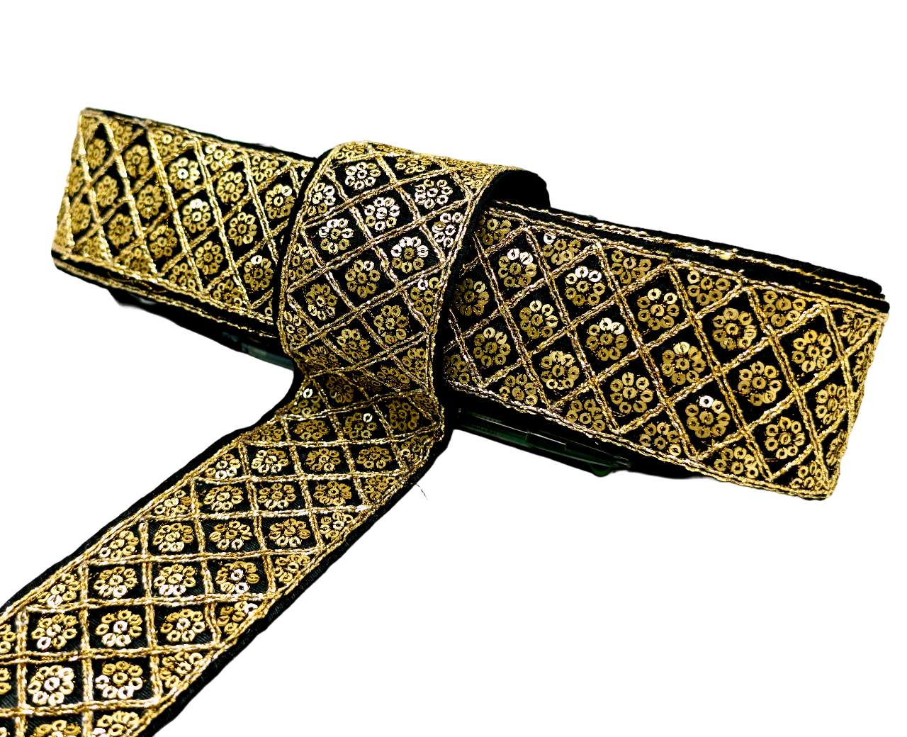 Decorative ribbon with gold and black pattern on a white background