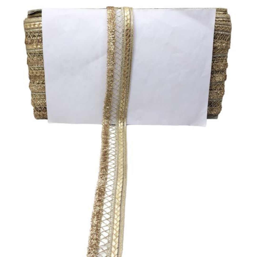 White fabric with gold trim on a white background