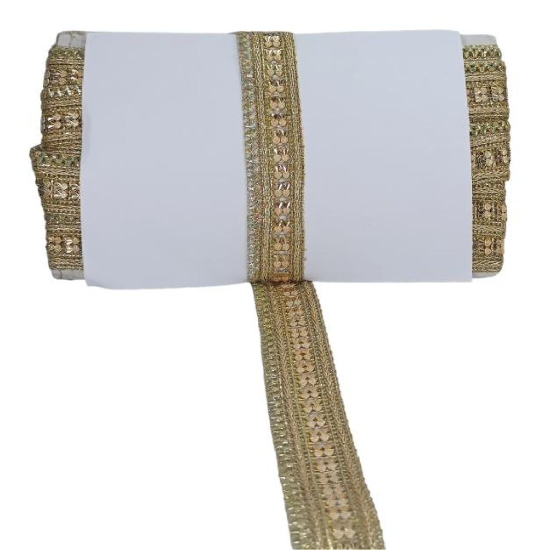 Gold decorative ribbon with intricate patterns on a white background