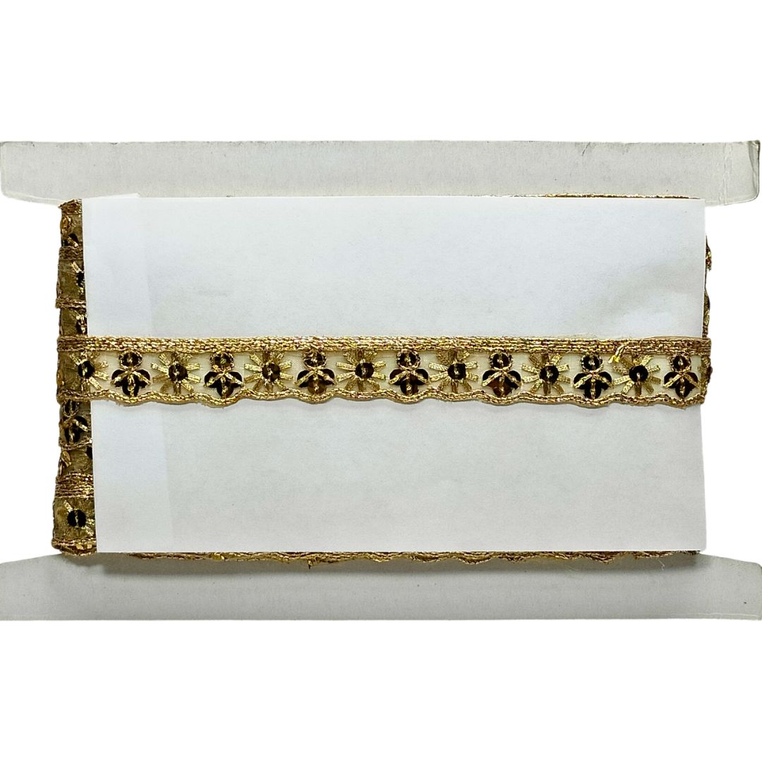 White clutch bag with gold decorative trim on a white background