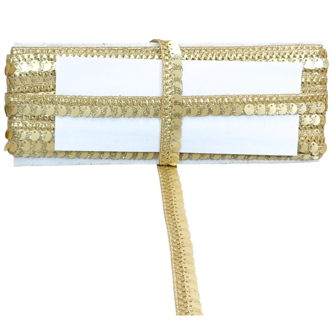 Gold sequin ribbon on a white background