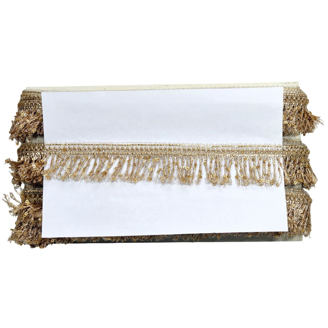 Gold fringe table runner on a white background