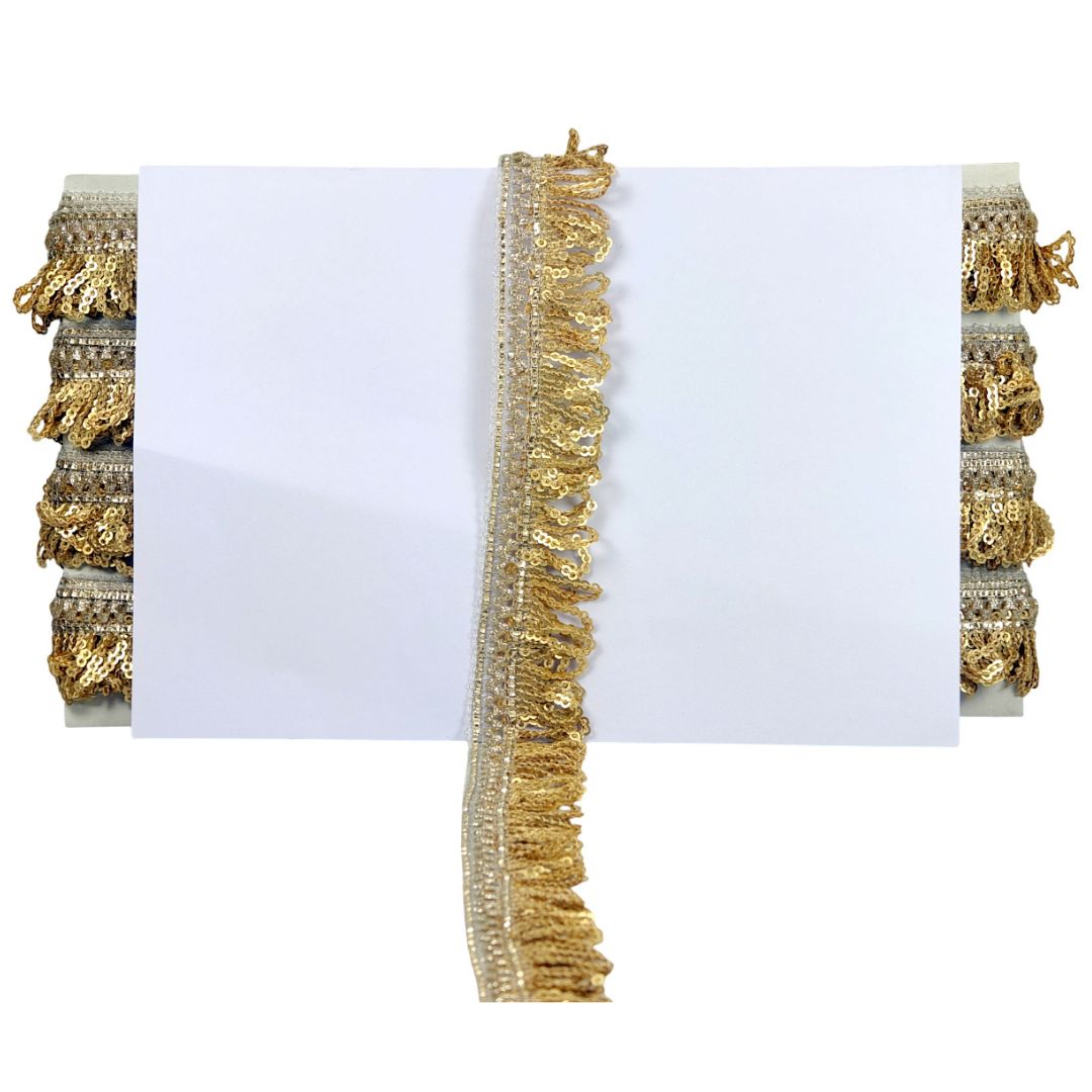 Decorative gold trim with fringe on a white background