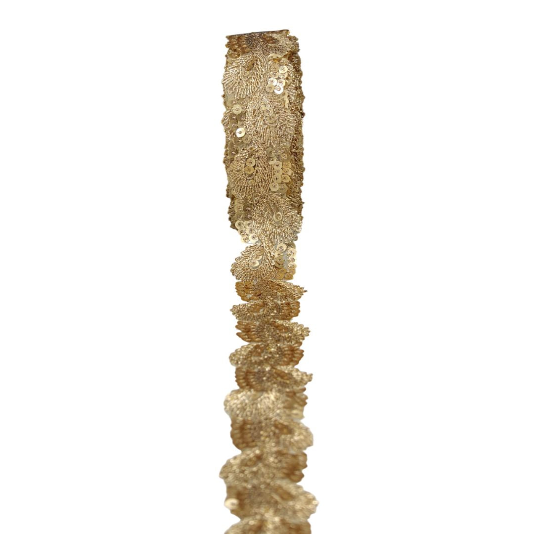 Gold sequin ribbon on a white background
