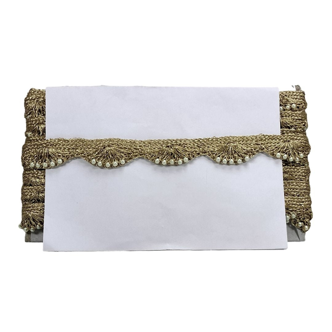 White clutch with gold braided trim on a white background