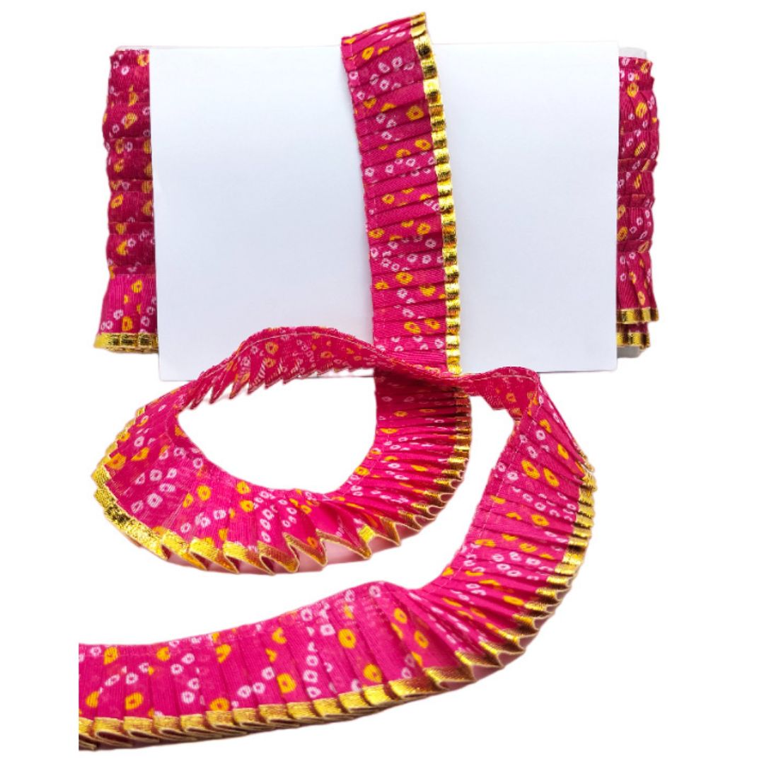 Pink and yellow patterned belt with floral design on a white background
