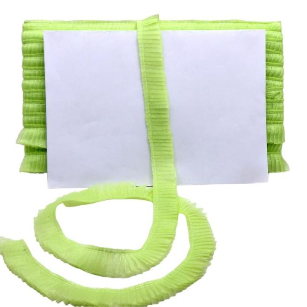 Green ribbed belt with a white card on a white background