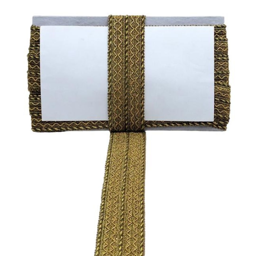 Gold decorative ribbon with a white card on a white background