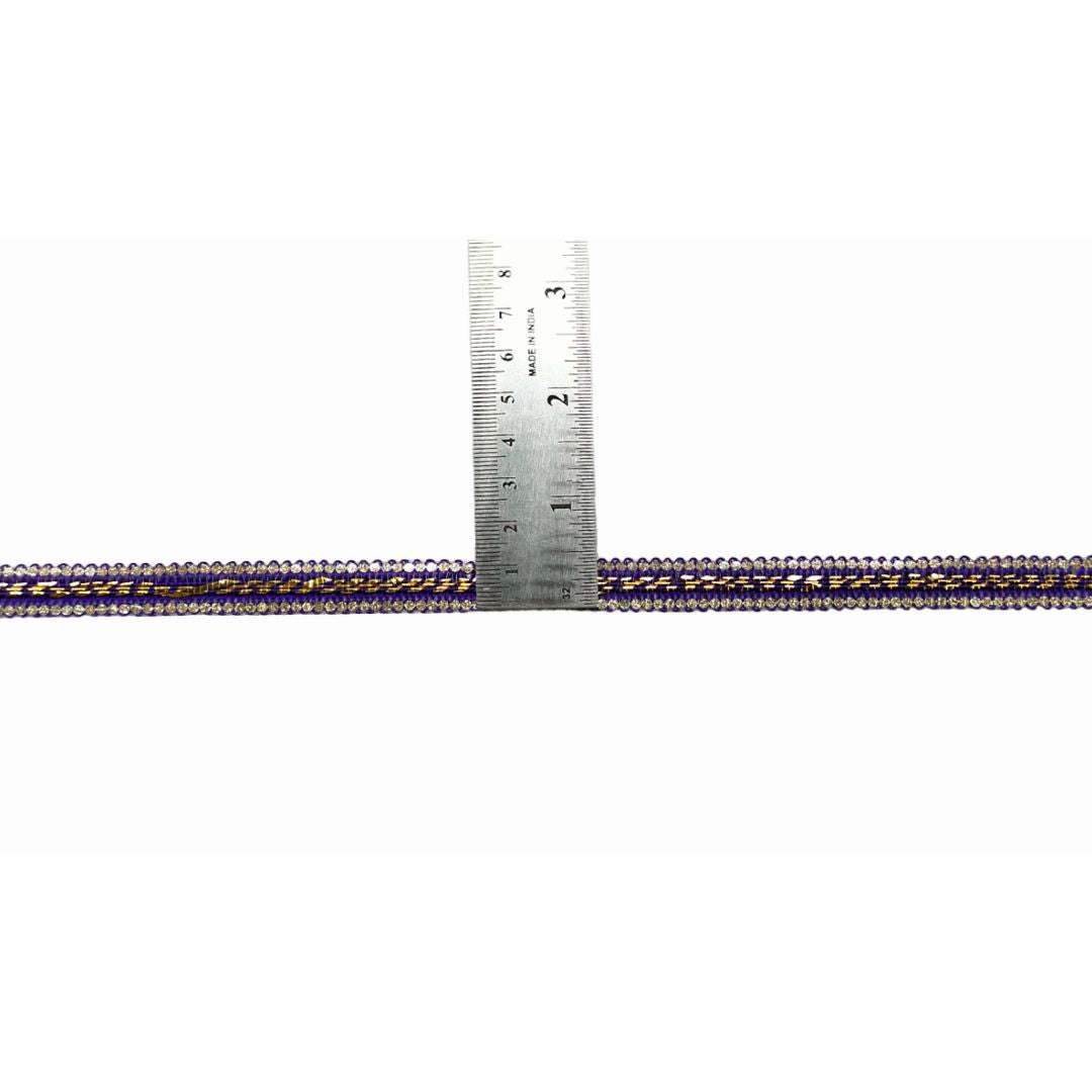 Metallic cord with a ruler showing measurement on a white background