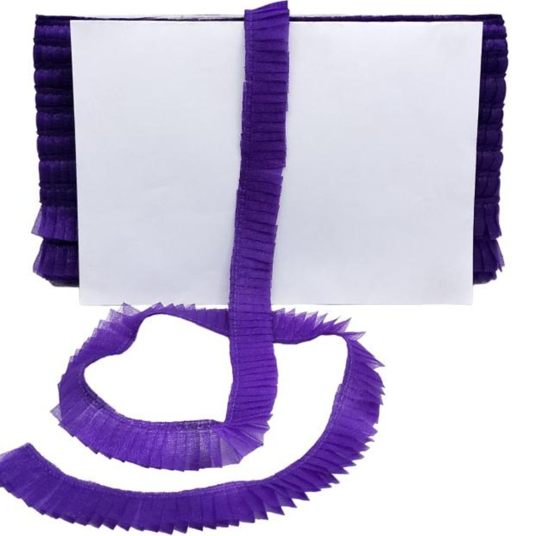 Purple ruffled trim on a white background
