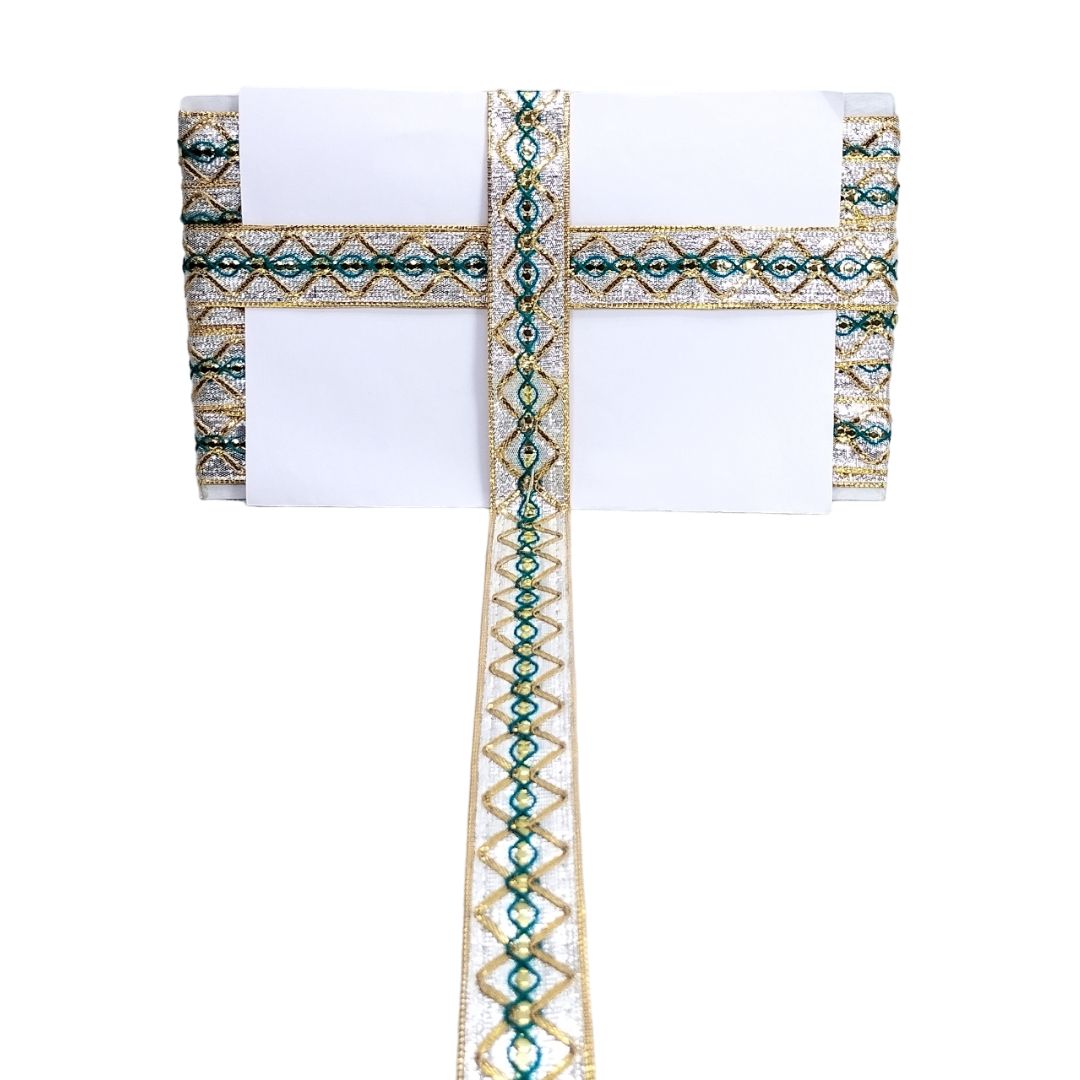 Decorative cross with intricate patterns on a white background