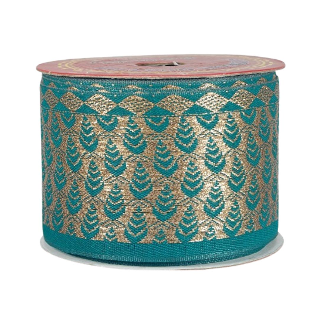 Roll of teal and gold patterned ribbon on a white background