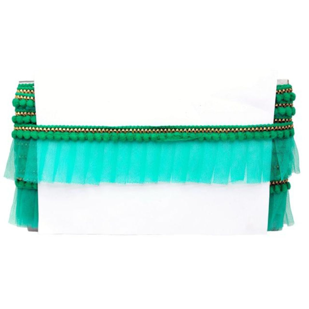 Green tulle skirt with decorative elements on a white background